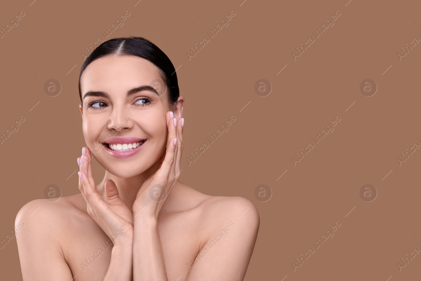 Photo of Beautiful woman with healthy skin on light brown background, space for text. Body Care