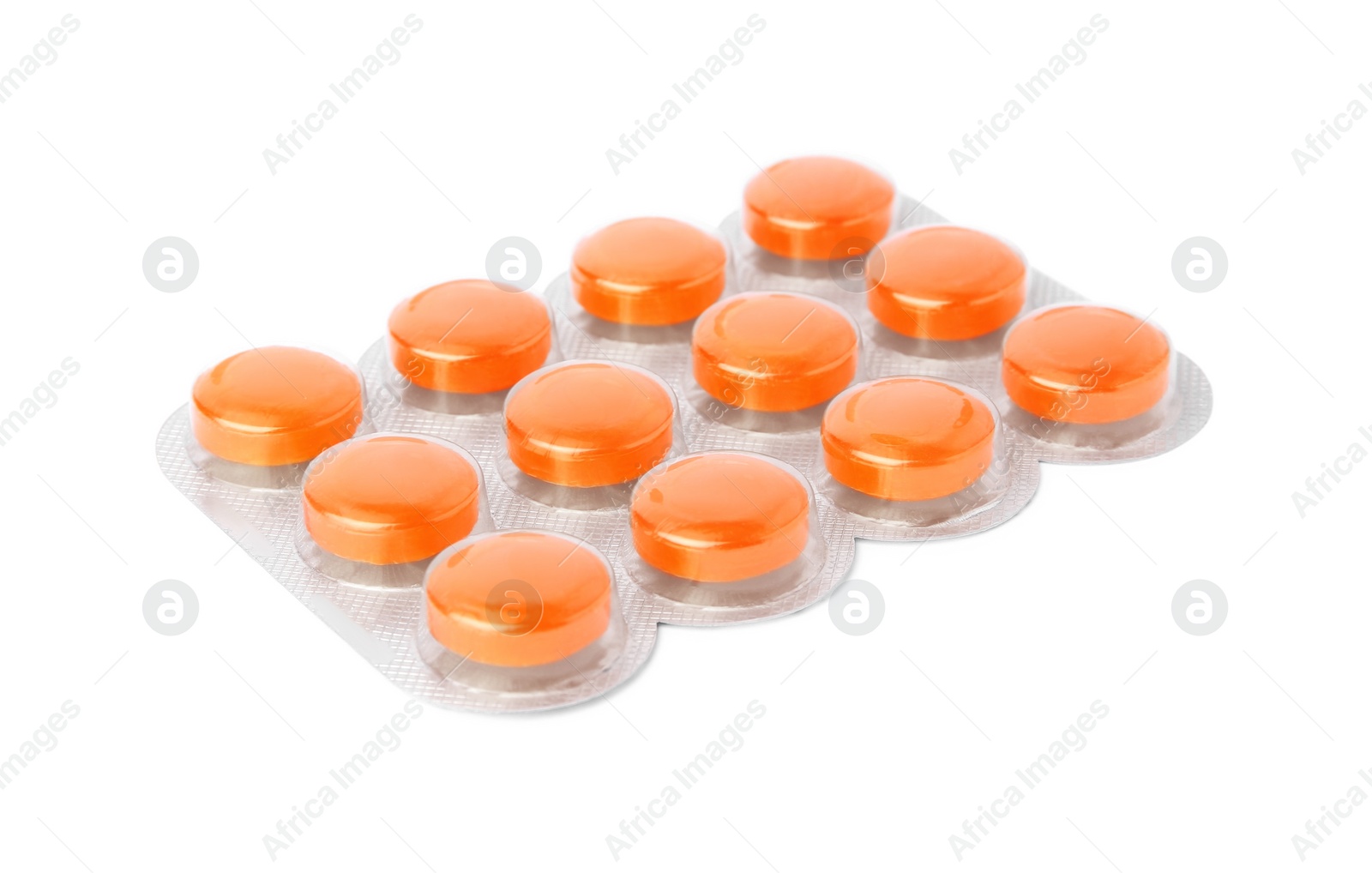 Photo of Blister with orange cough drops isolated on white