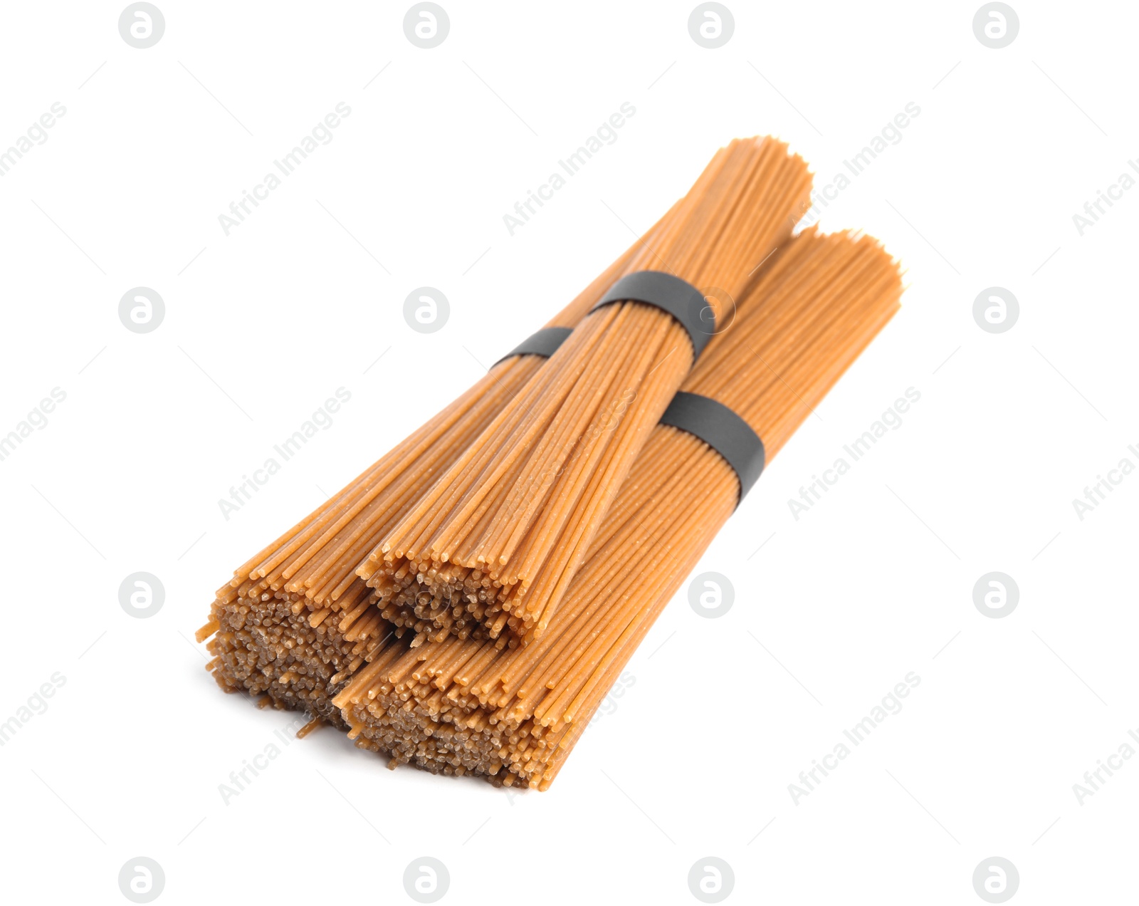 Photo of Uncooked buckwheat noodles isolated on white. Japanese cuisine