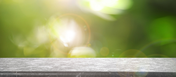 Empty stone surface against blurred background. Bokeh effect