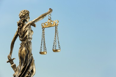 Symbol of fair treatment under law. Figure of Lady Justice against sky, closeup with space for text