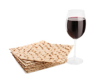 Photo of Traditional matzos and red wine on white background
