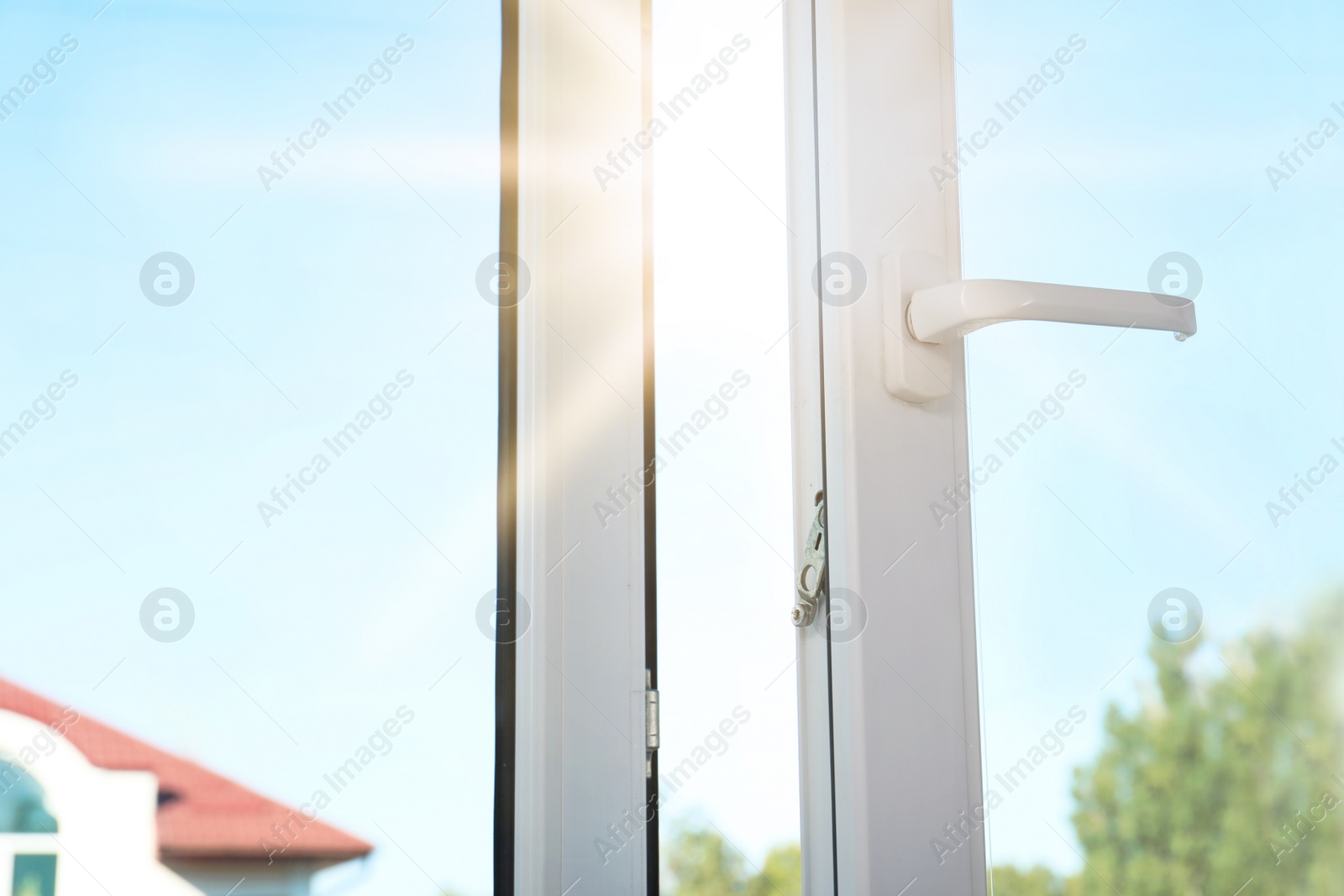 Image of Bright sun shining through window. Good weather