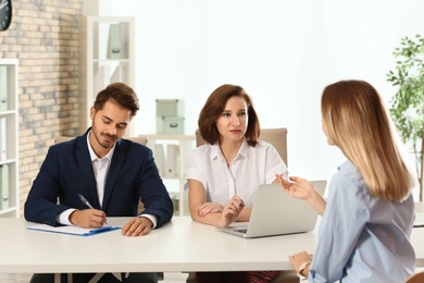 Human resources commission conducting job interview with applicant in office