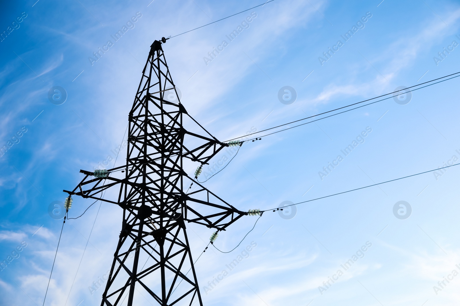 Photo of High voltage tower against beautiful blue sky