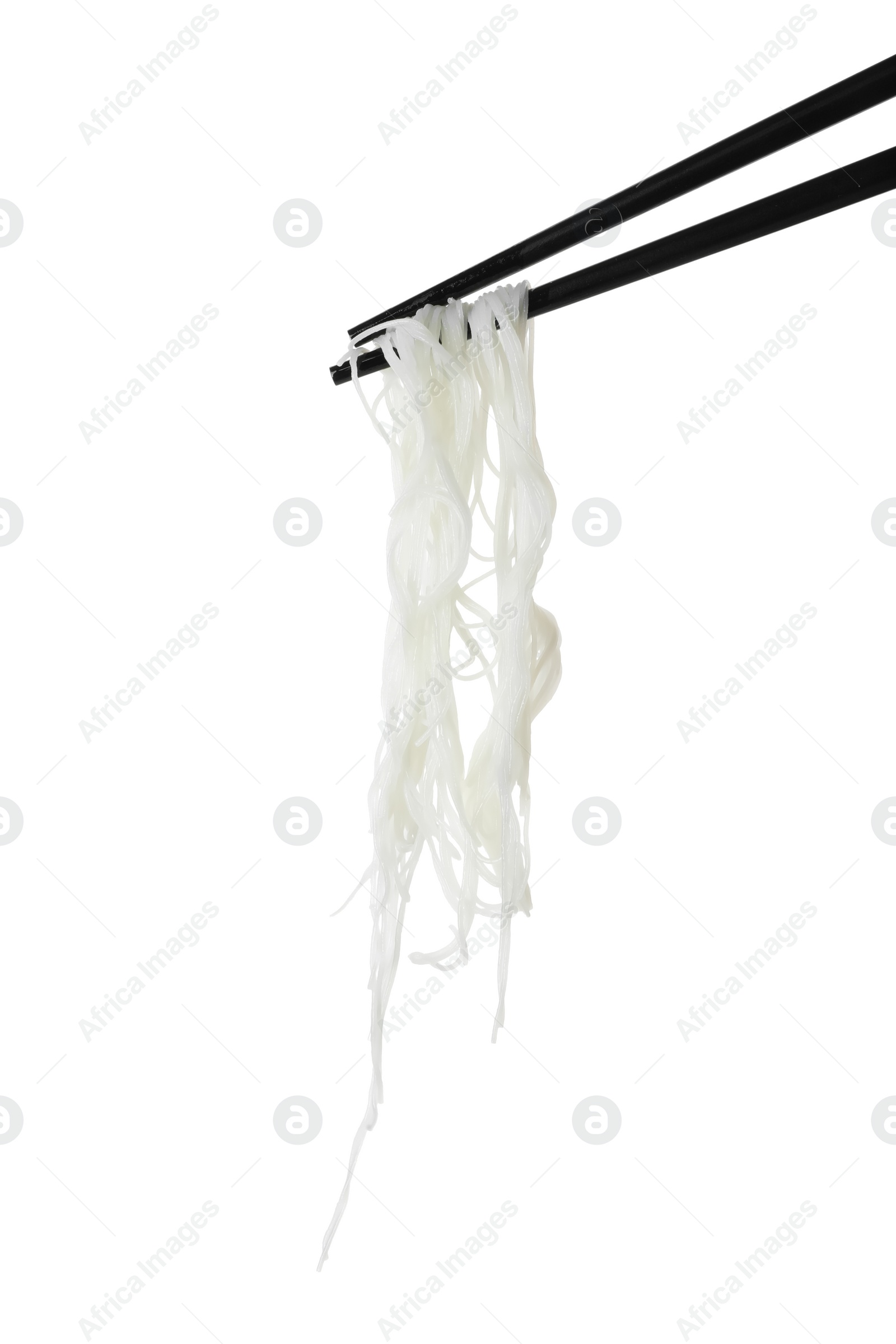 Photo of Chopsticks with tasty cooked rice noodles isolated on white