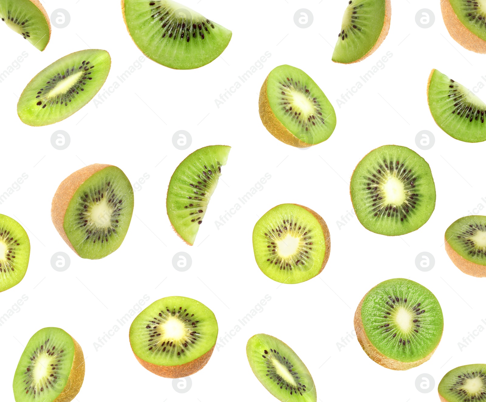 Image of Set with cut ripe kiwi fruits falling on white background