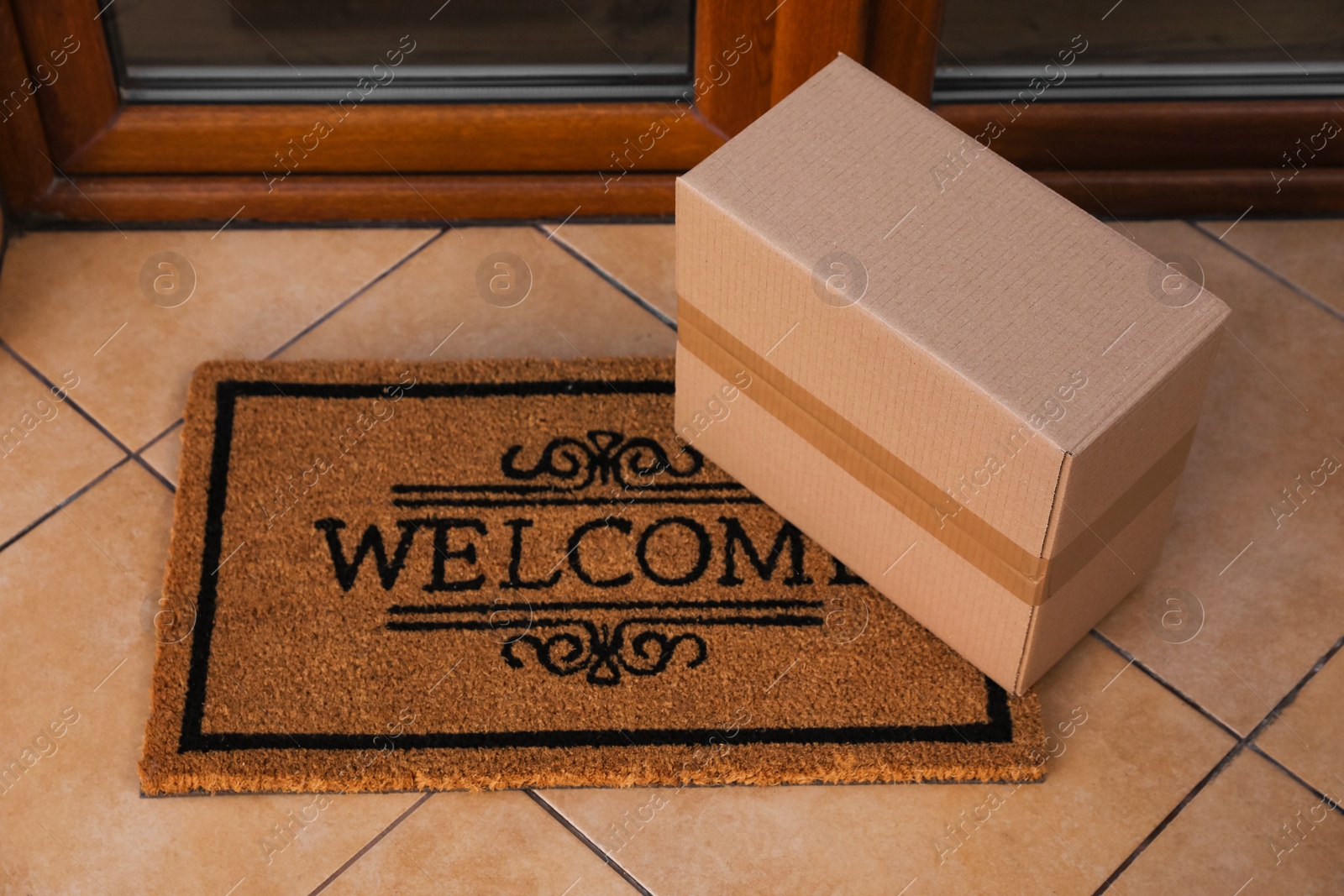 Photo of Parcel delivered on mat near front door