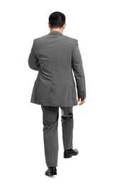 Photo of Businessman in suit walking on white background, back view