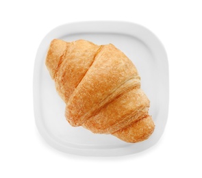 Plate with tasty croissant on white background, top view