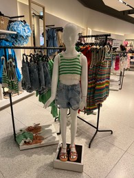 Photo of WARSAW, POLAND - JULY 17, 2022: Fashion store display with kids clothes in shopping mall
