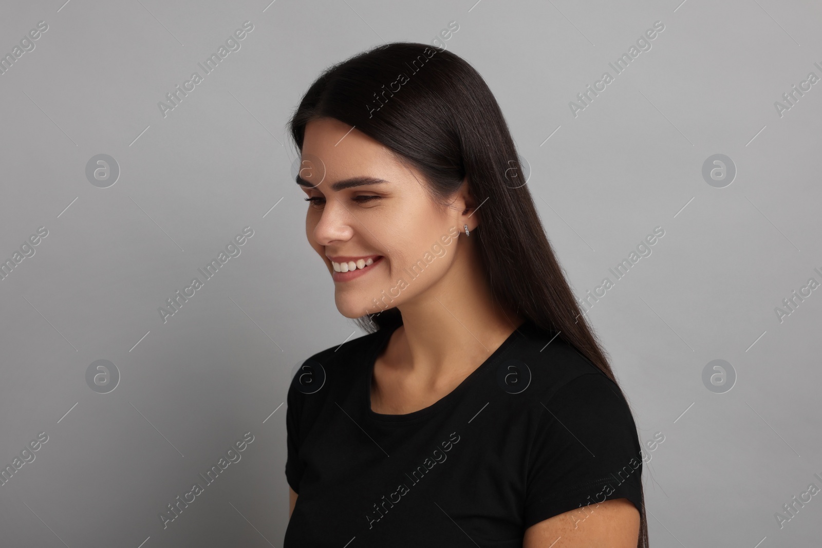 Photo of Personality concept. Emotional woman on grey background