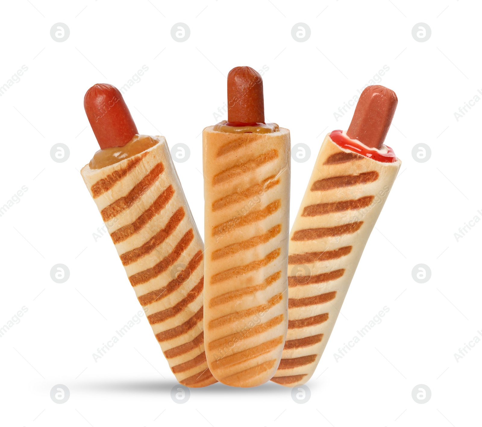 Image of Set of yummy French hot dogs with grilled buns and different sauces isolated on white