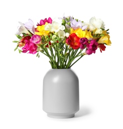 Photo of Vase with beautiful spring freesia flowers isolated on white