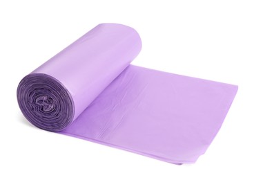 Photo of Roll of violet garbage bags on white background. Cleaning supplies