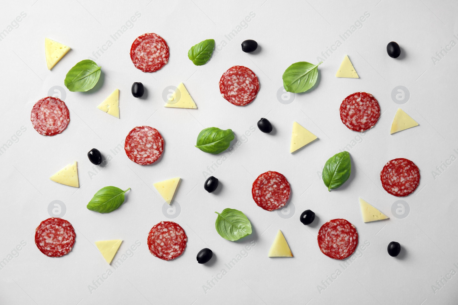 Photo of Flat lay composition with ingredients for pizza on light background
