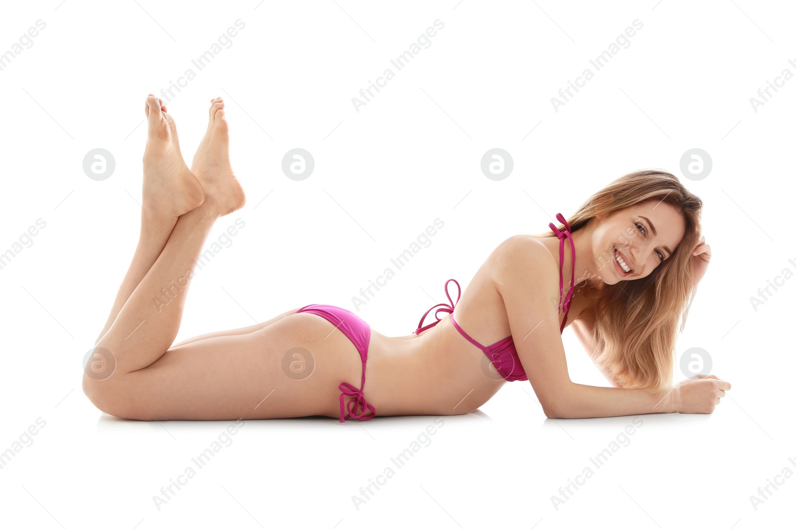 Photo of Young slim woman in bikini on white background. Perfect body