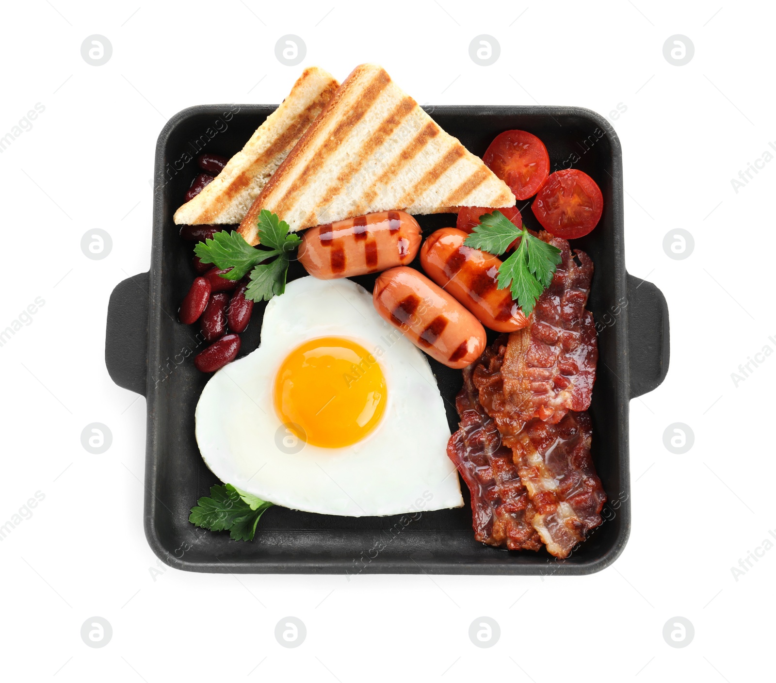 Photo of Frying pan of tasty breakfast with heart shaped egg and sausages isolated on white, top view