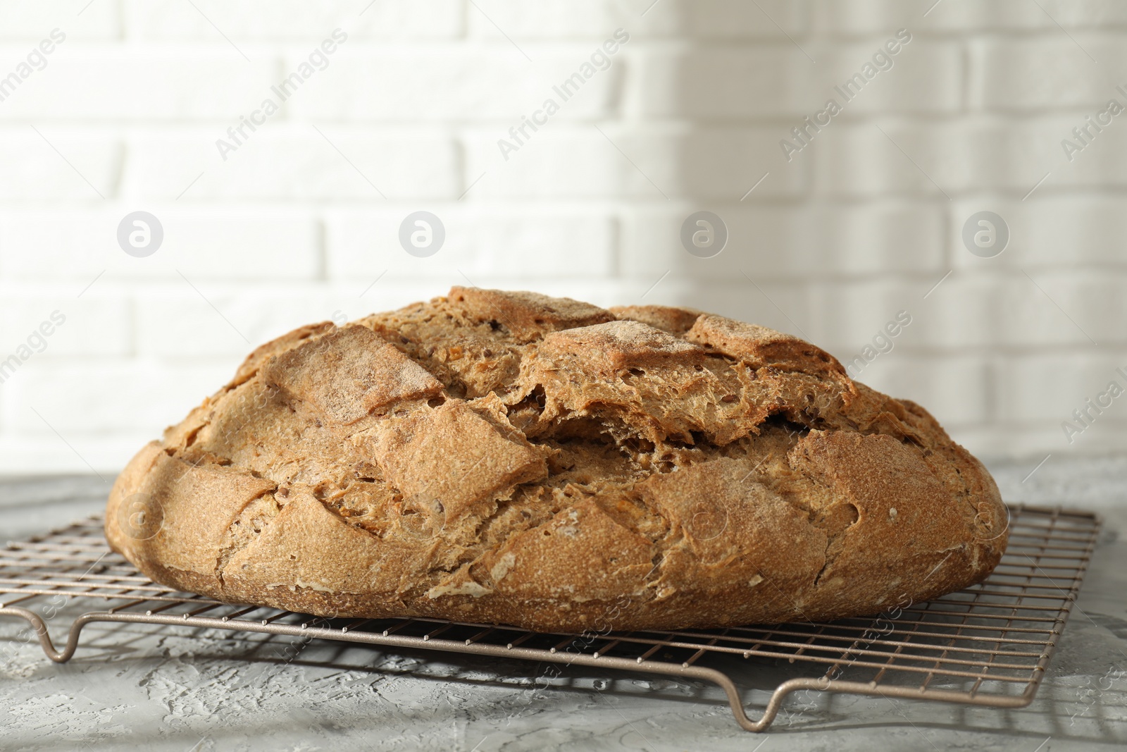 Photo of Freshly baked sourdough bread on grey table