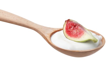 Photo of Wooden spoon with yogurt and fig isolated on white