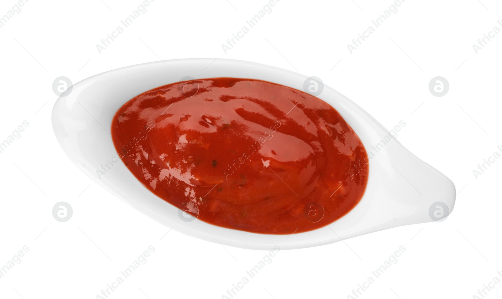 Photo of Gravy boat with spicy chili sauce on white background, top view