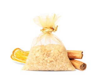Photo of Scented sachet with aroma beads, cinnamon and dried orange slices on white background