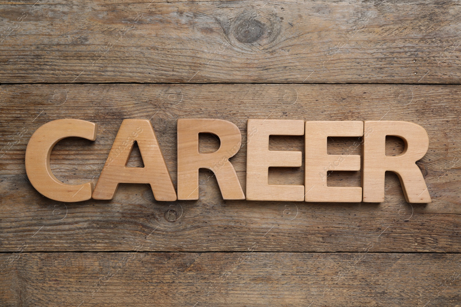 Photo of Word CAREER on wooden background, flat lay