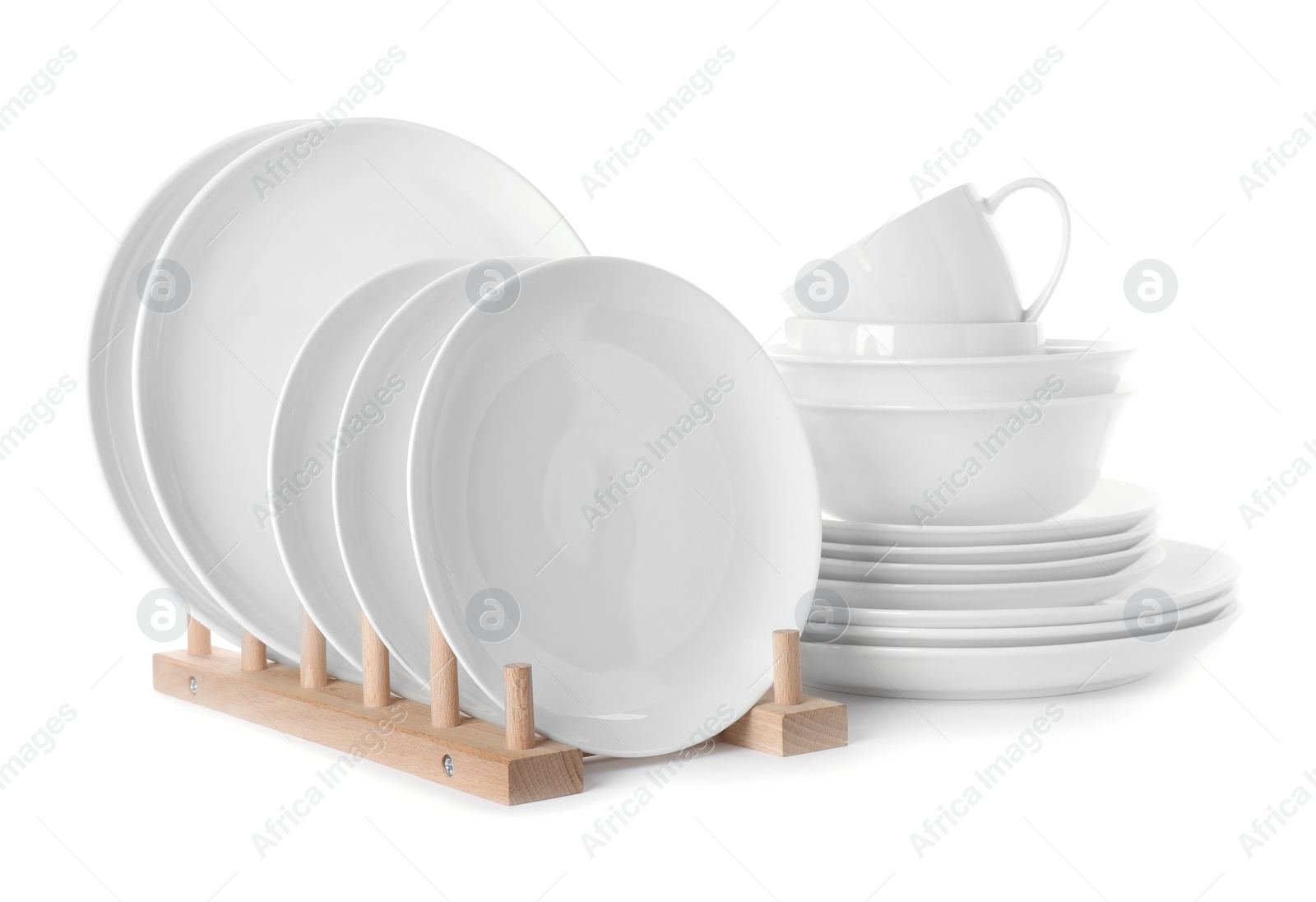 Photo of Set of clean tableware isolated on white