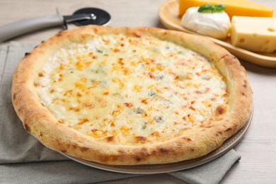 Delicious cheese pizza on wooden table, closeup