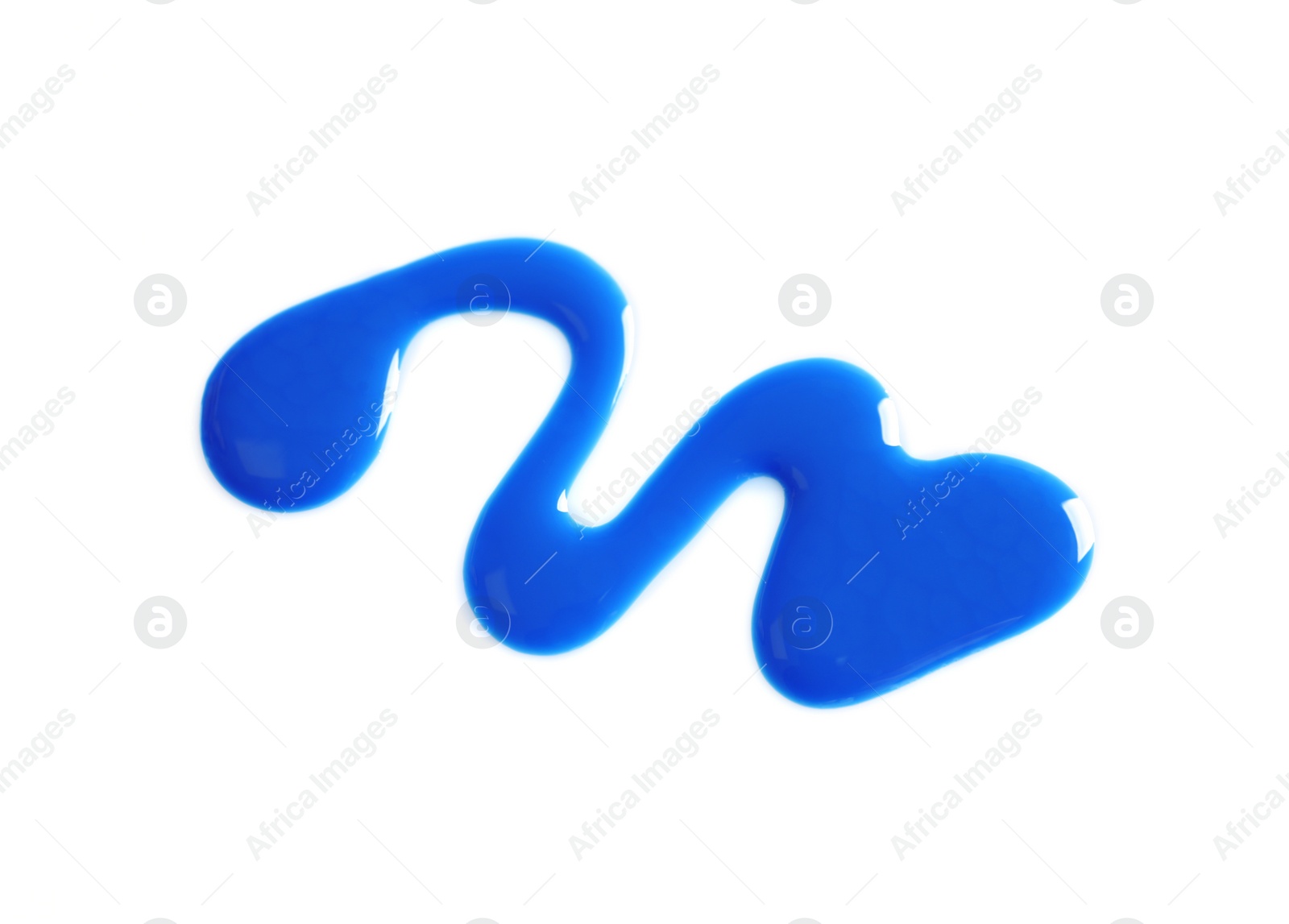 Photo of Spilled bright nail polish on white background, top view