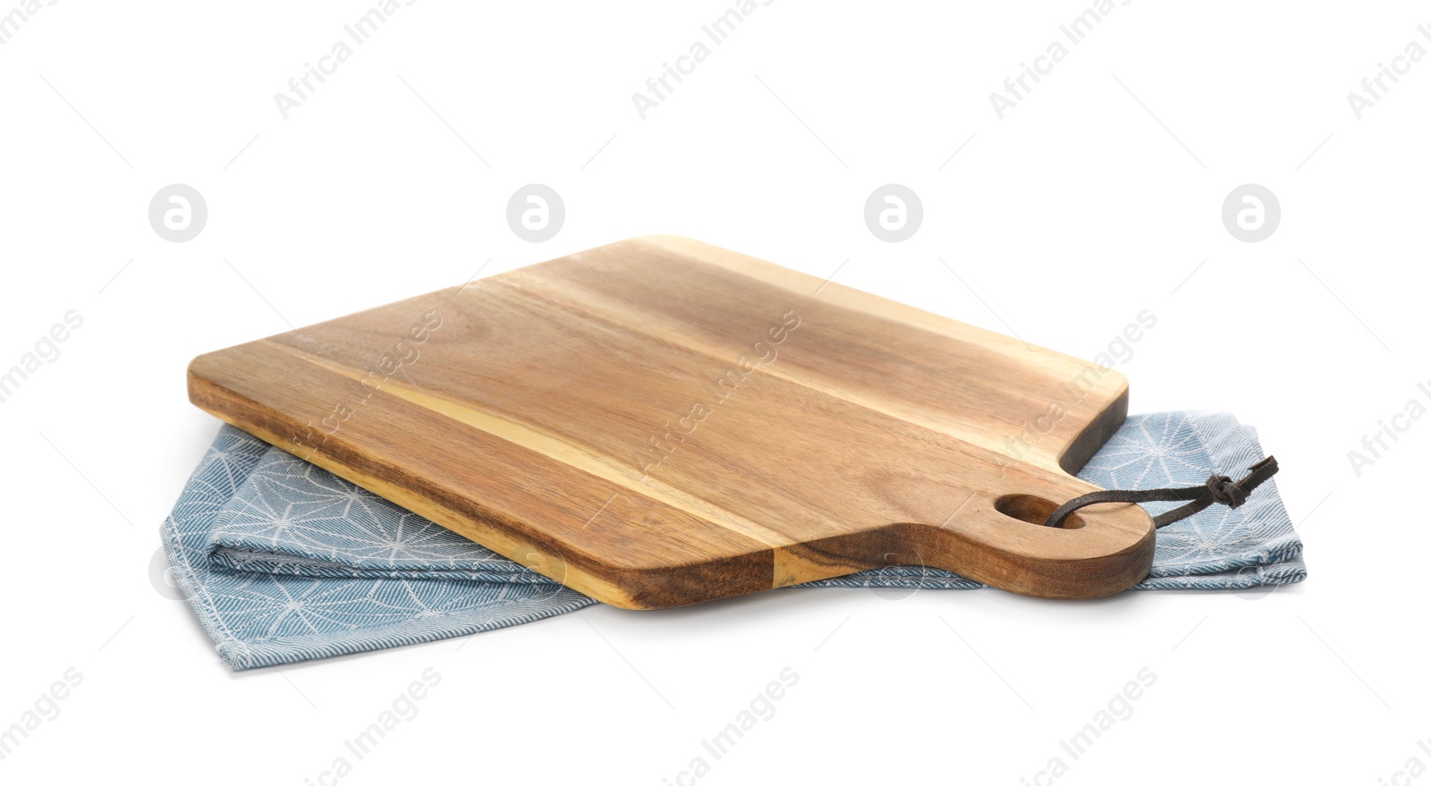 Photo of Wooden cutting board with kitchen towel isolated on white. Cooking utensil