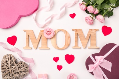 Beautiful composition with word "MOM" on white background. Happy Mother's Day