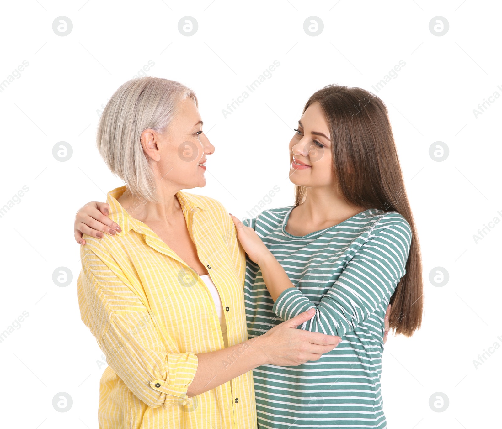 Photo of Portrait of young woman with her mature mother on white background