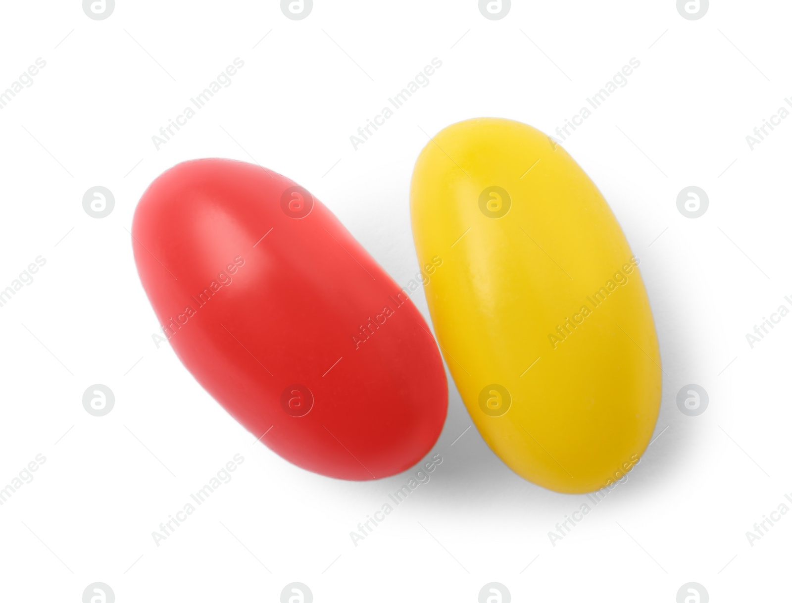 Photo of Tasty bright jelly beans isolated on white, top view