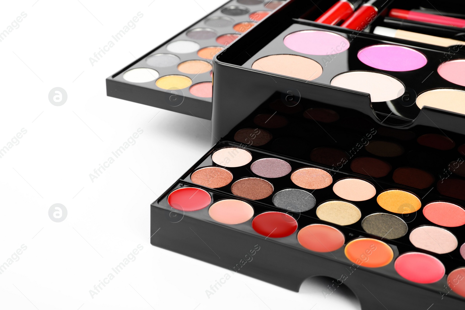 Photo of Large makeup case with different decorative cosmetics on white background