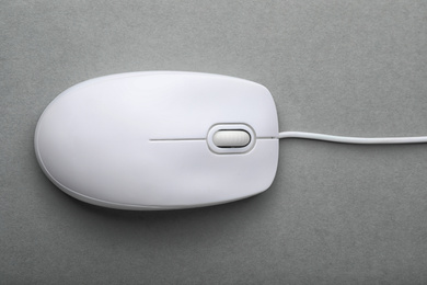 Photo of Modern wired computer mouse on grey background, top view