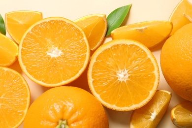 Flat lay composition with ripe oranges on color background