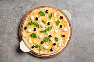 Photo of Fresh tasty homemade pizza on table, top view