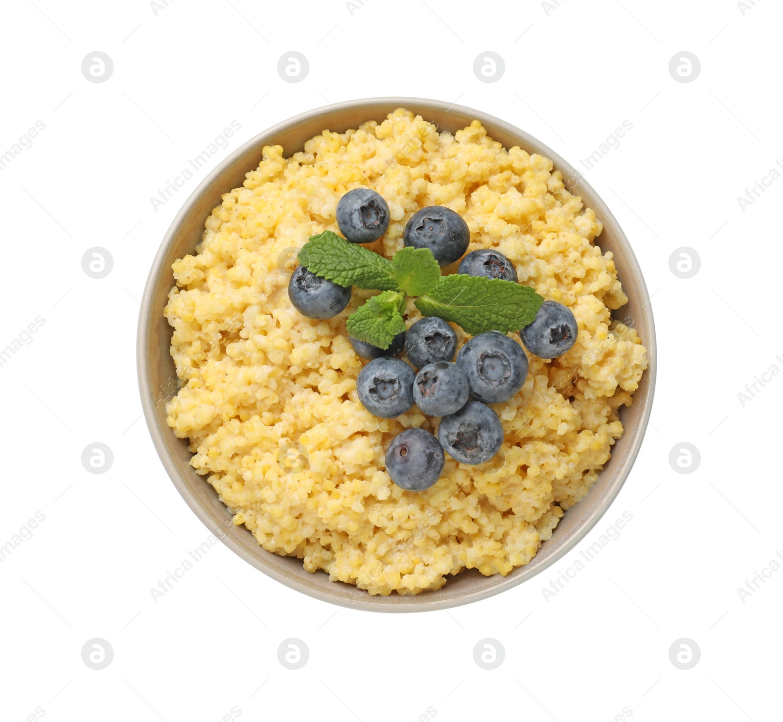 Photo of Tasty millet porridge with blueberries and mint in bowl isolated on white, top view