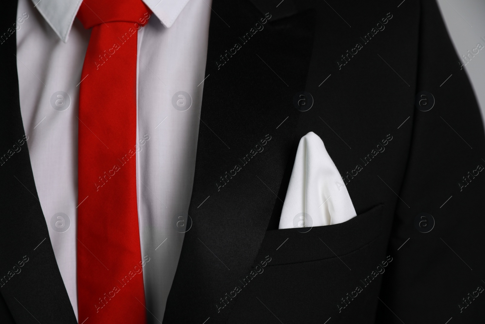 Photo of Man with handkerchief in suit pocket, closeup view