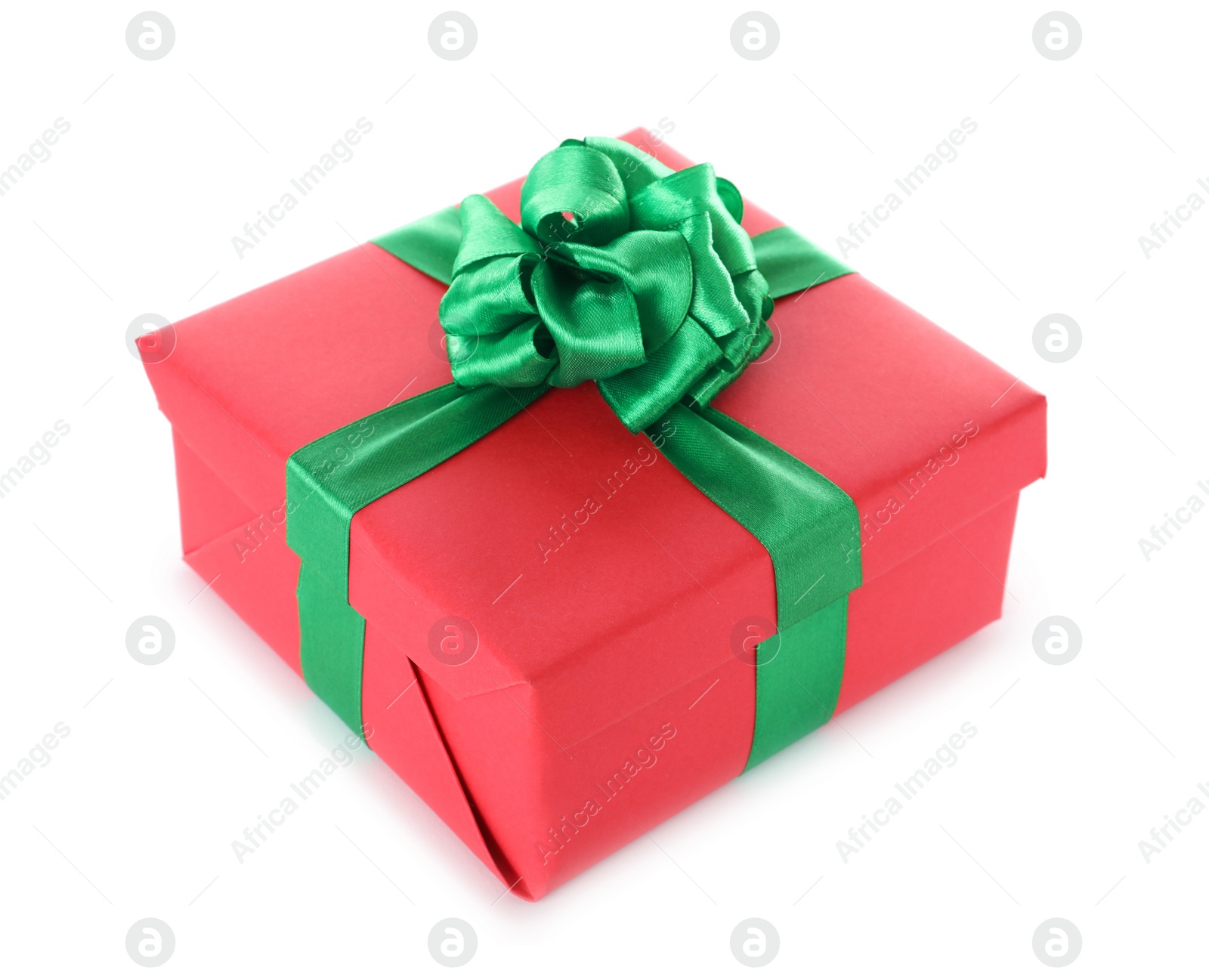 Photo of Christmas gift box decorated with ribbon bow on white background