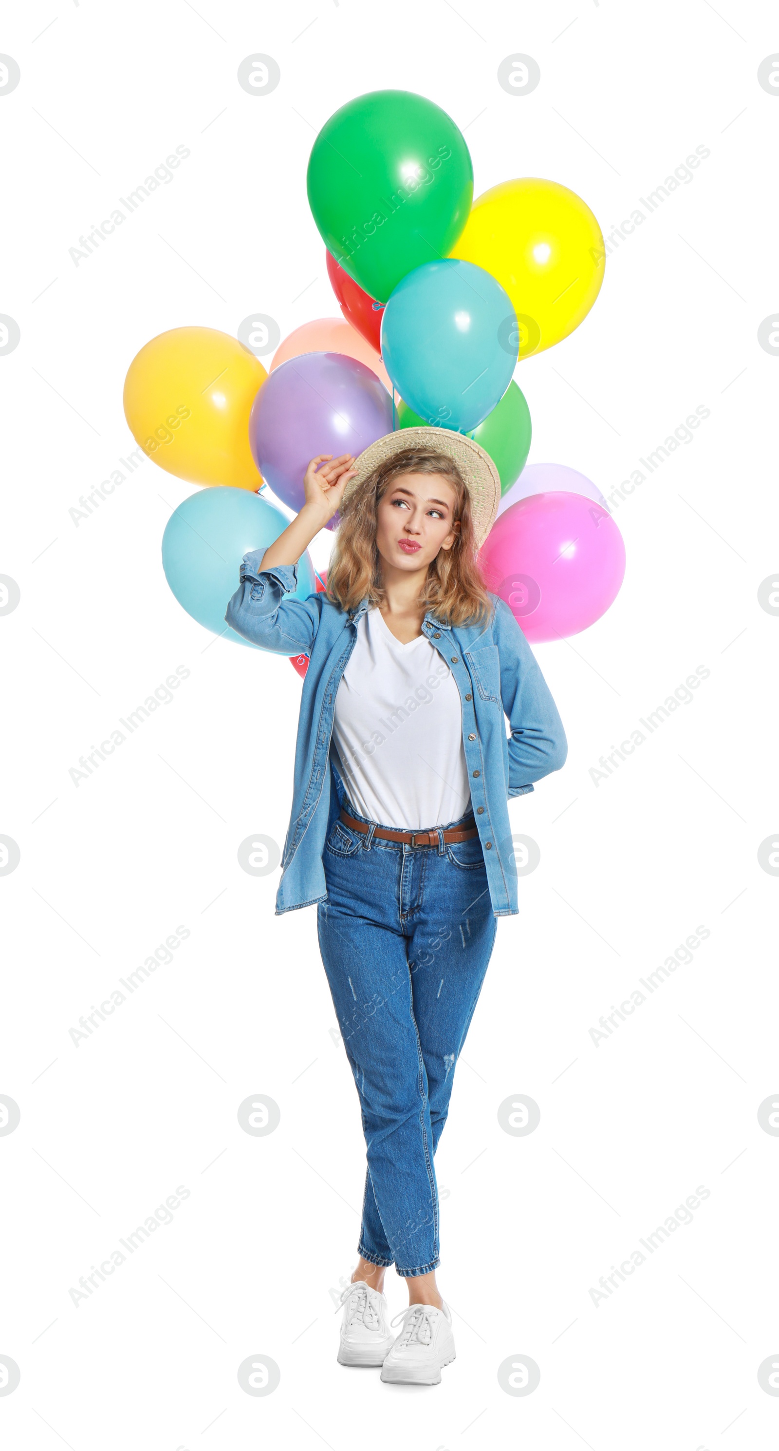 Photo of Emotional young woman holding bunch of colorful balloons on white background