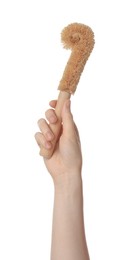 Photo of Woman holding eco friendly brush for dish washing on white background, closeup. Conscious consumption