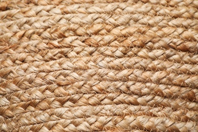 Elegant woman's straw bag as background, closeup