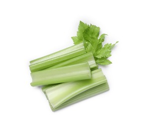 Photo of Fresh cut celery stalks and leaf isolated on white, top view