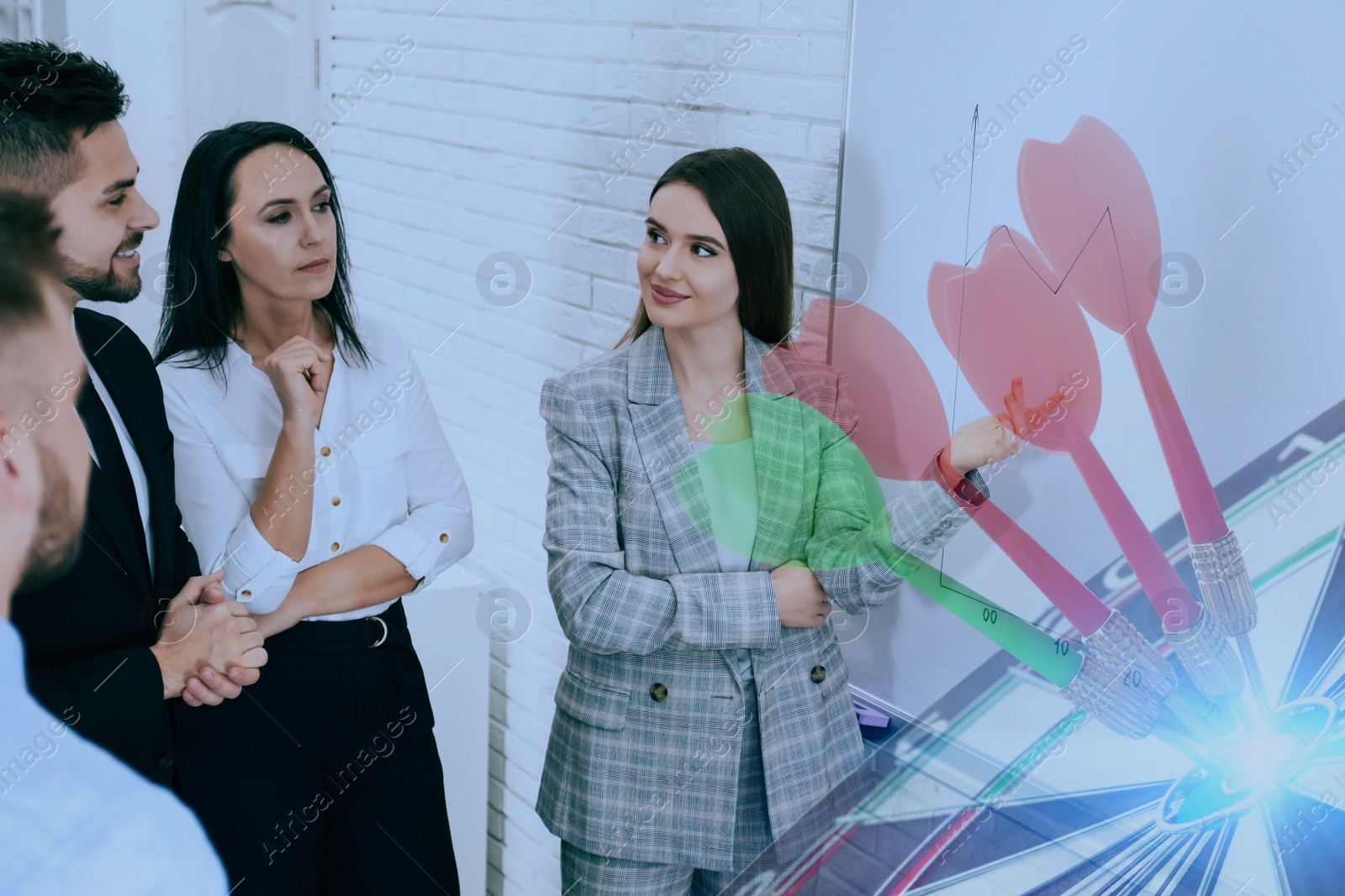 Image of People having business meeting and dart board with arrows. Double exposure