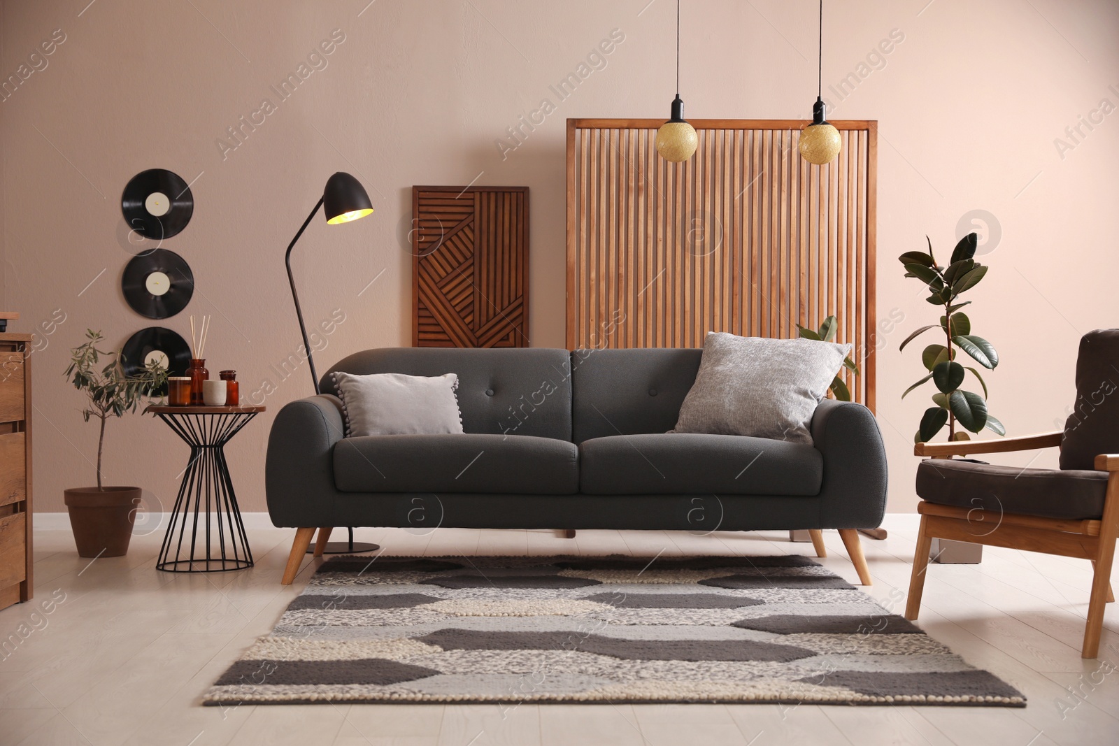 Photo of Stylish living room interior with comfortable dark sofa