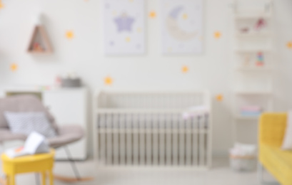 Blurred view of stylish baby room interior