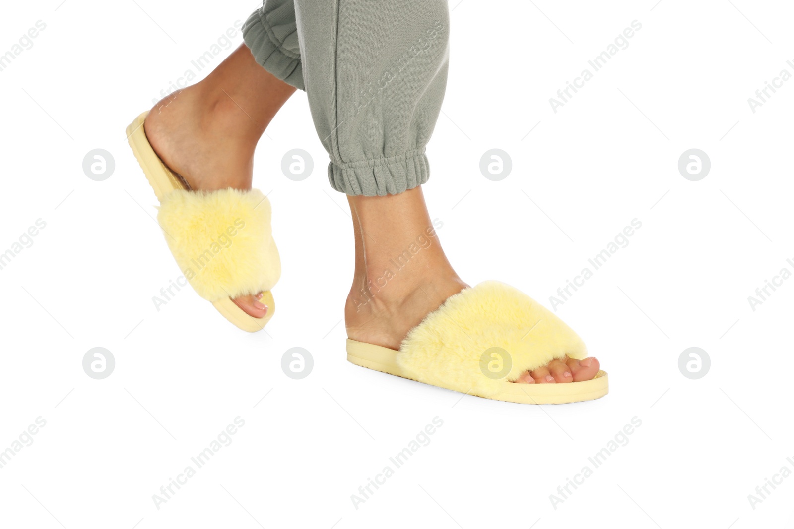 Photo of Woman in fluffy slippers on white background, closeup