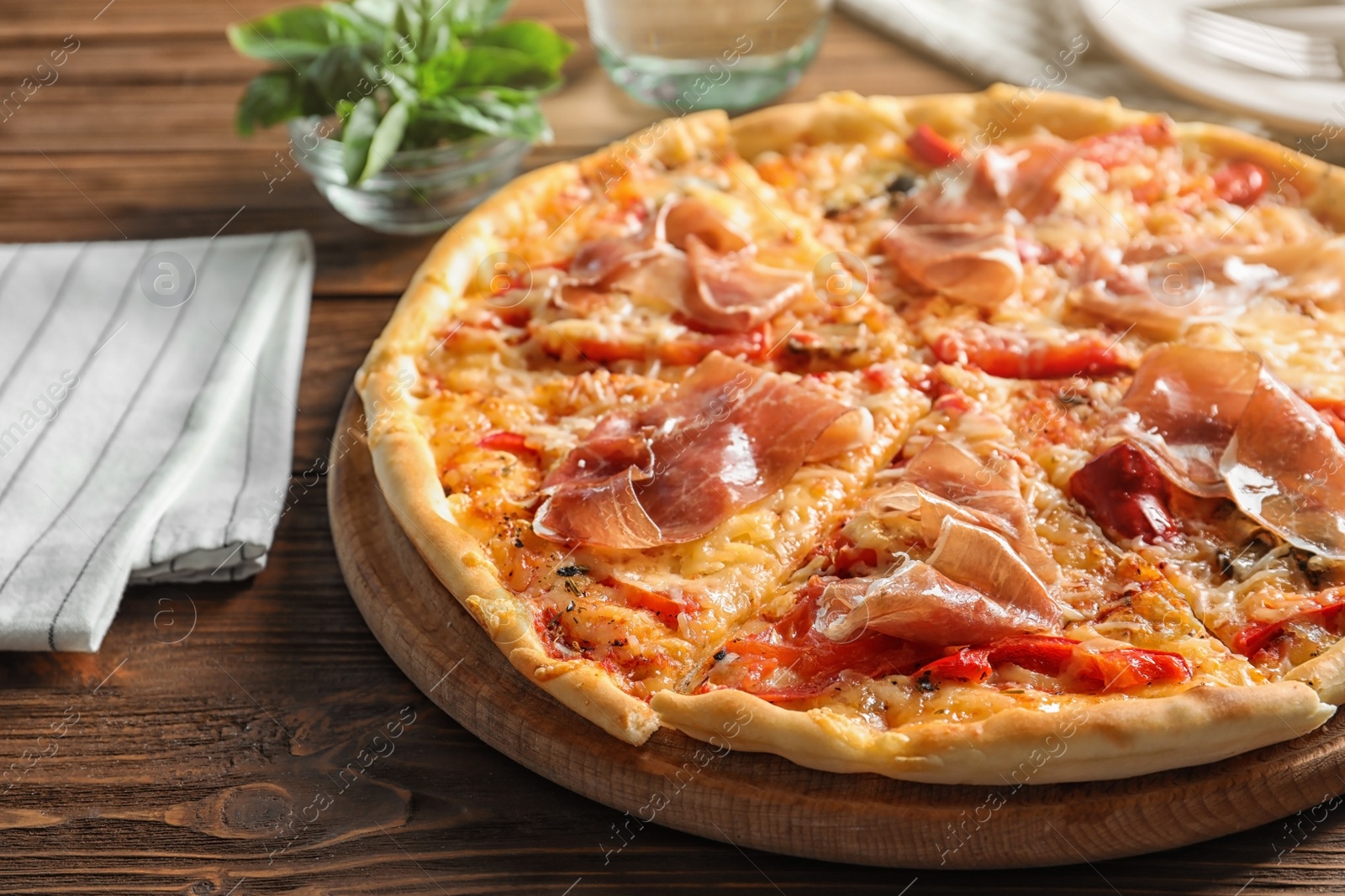 Photo of Delicious hot pizza with meat on table